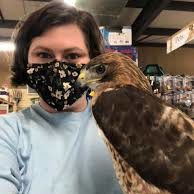 Woman in Mask Holds Raptor